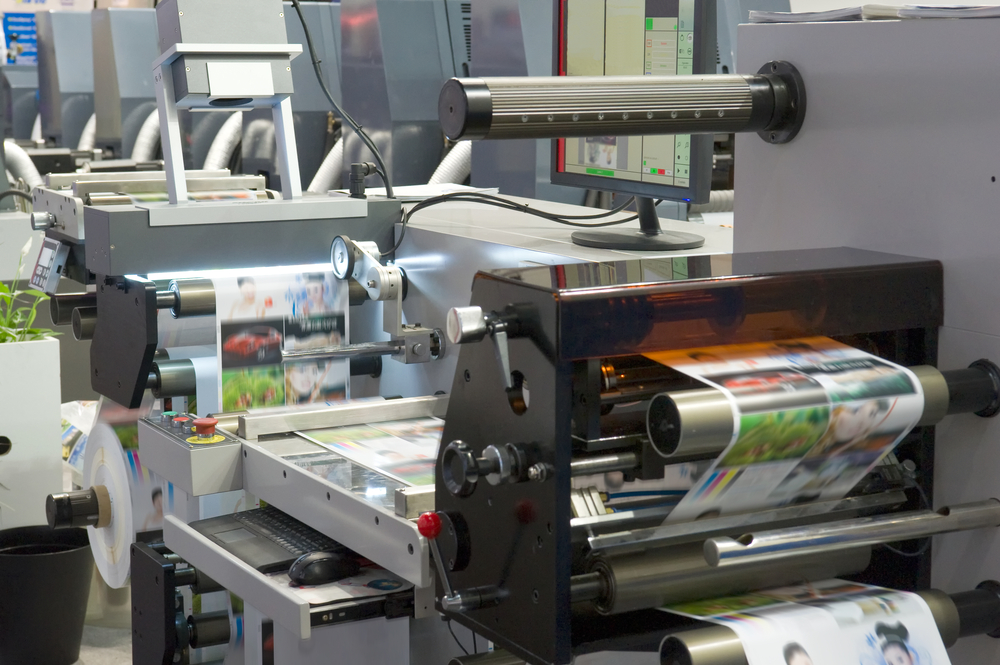Professional print shop press running high volume colour printing, showing why print shop vs home printing favours professionals at scale